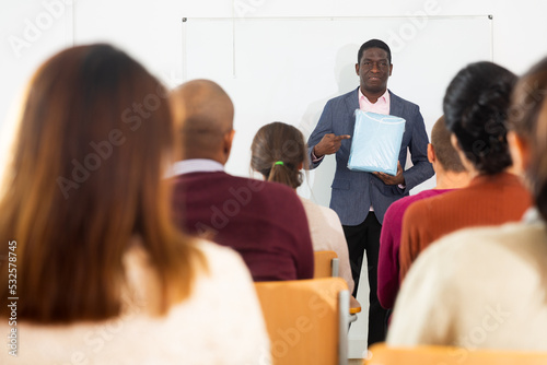 An entrepreneur advertises product at a business training