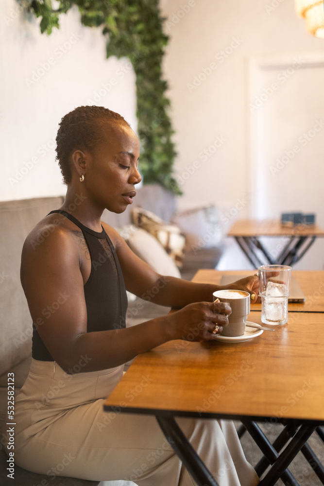 young black woman in a coffee shop young black woman in a coffee shop