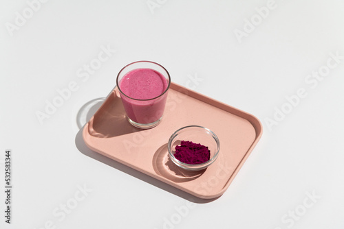 Pitaya dragon fruit healthy superfood drink with glass, bottle powder photo