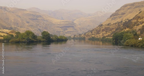 Downstream on the Snake River into Hells Canyon, the deepest river gorge in North America. Appropriately Canyon view is hazy with smoke from Oregon-California wildfires.
