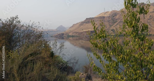 Shoreline reflects in still waters of the Snake River in Hells Canyon on the Idaho-Oregon border. Hells Canyon is a ten-mile-wide canyon and is the deepest river gorge in North America.