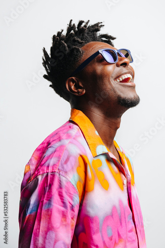 Cheerful black man in trendy outfit