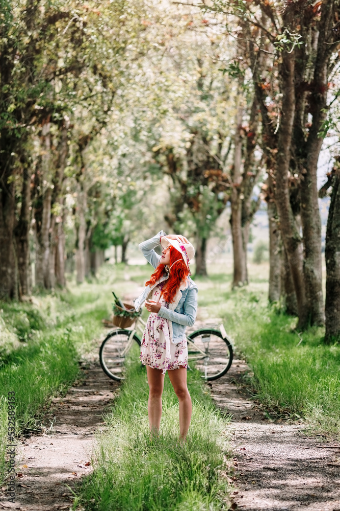 Woman in the middle of a tree tunnel Woman in the middle of a tree tunnel