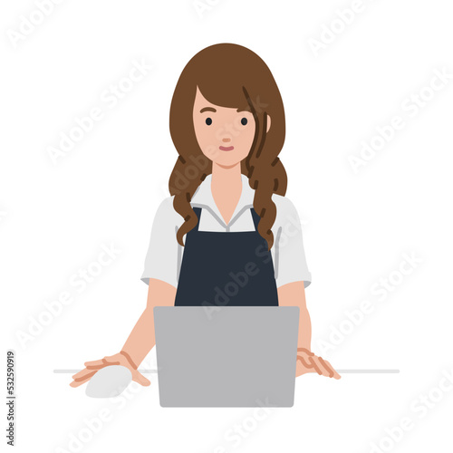 デスクで座ってPCを使っている店員の女性