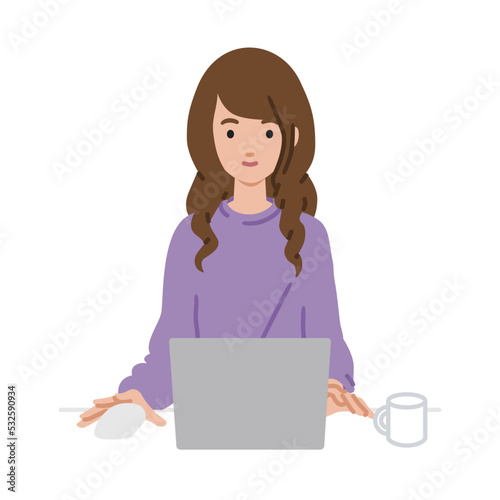 デスクで座ってPCを使っているリモートワークの女性