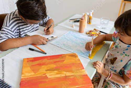 Children painting at art classes photo