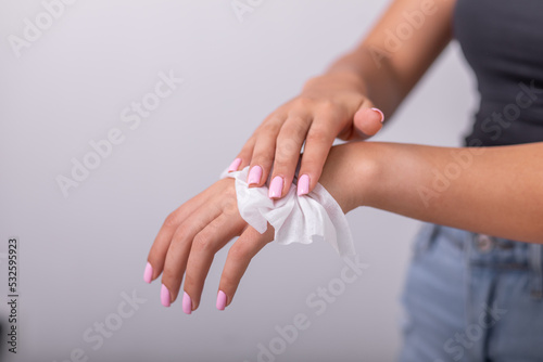 Cleaning hands with wet wipes  liht pink nails  prevention of infectious diseases  corona19