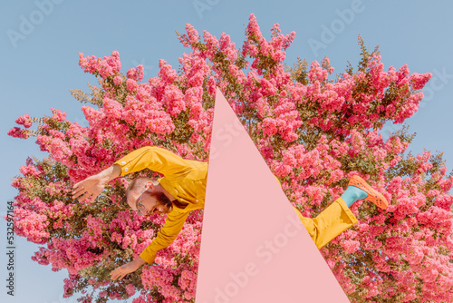 Man poses with triangle photo