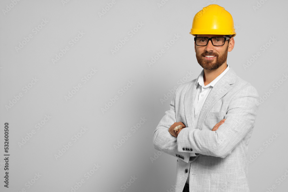 Professional engineer in hard hat on white background, space for text Professional engineer in hard hat on white background, space for text