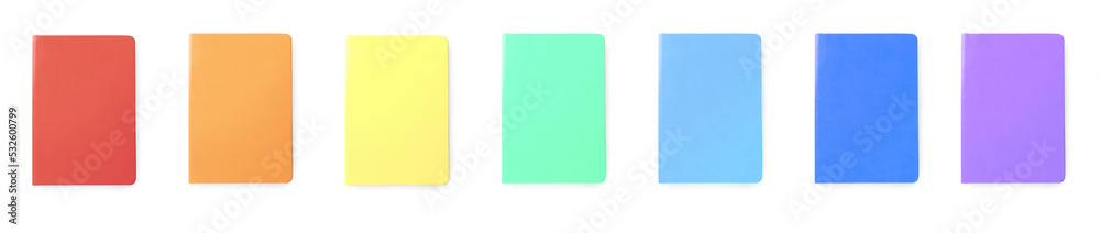 Fototapeta premium Set with multicolor notebooks on white background, top view. Banner design