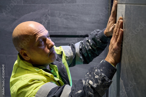 Tile pusing tile into place