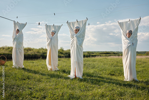 Four Slavic Women In White Fabric photo