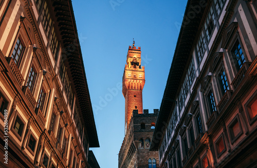 Uffizi Gallery and Arnolfo's Tower lit at night. photo