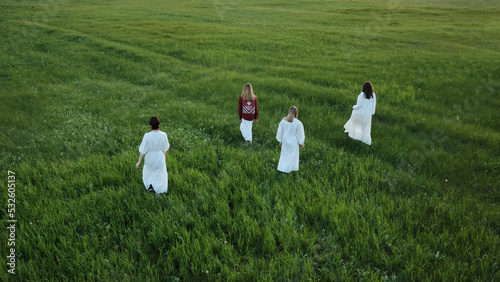 Women Walking Along Meadow
