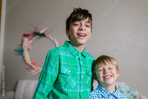 Brothers laughing indoor at christmas