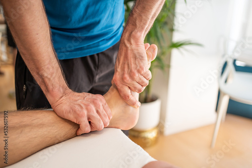 Detail Of A Physiotherapist Giving A Massage In A Clinic. photo