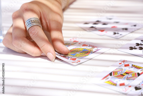 hand of woman playing card game photo