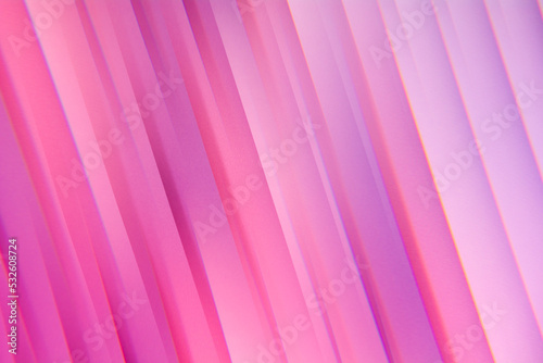 Pink abstract colorful geometric lines made of paper