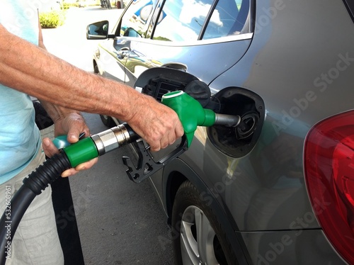 fueling a car at a gas station