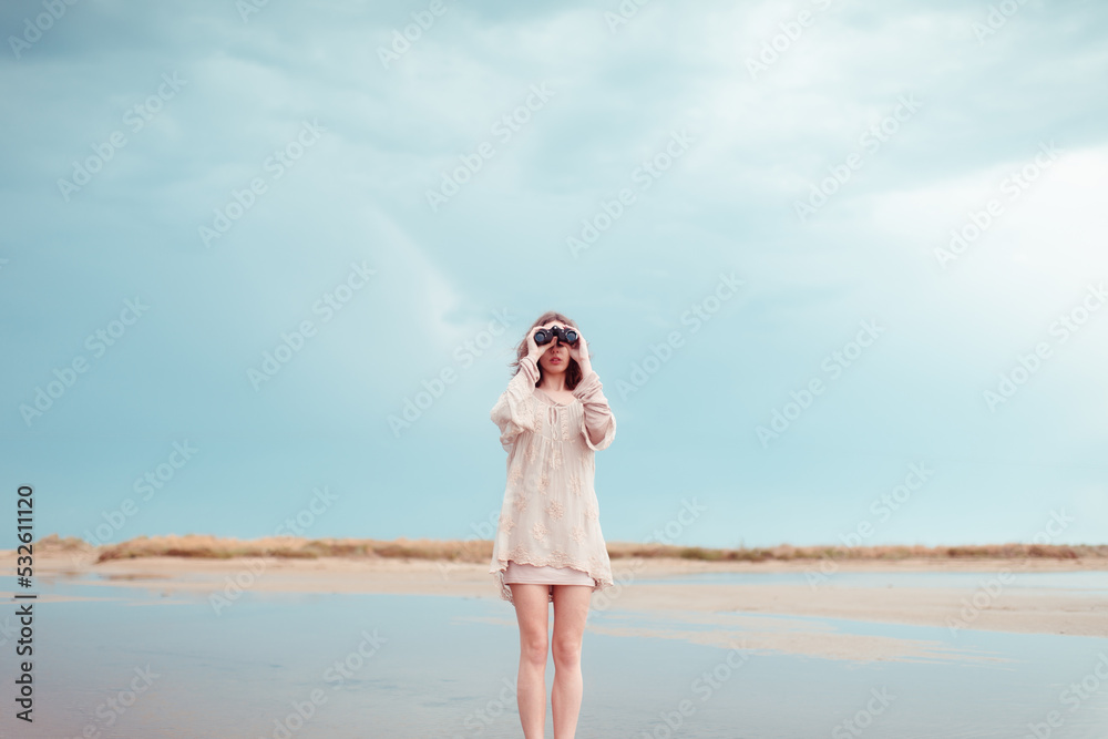 Portrait of woman using binoculars at wild beach
Portrait of woman using binoculars at wild beach