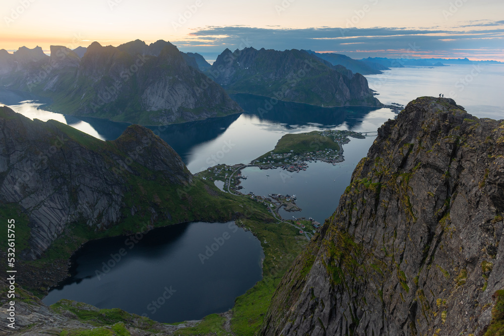 Couple on top of the summit in Lofoten Couple on top of the summit in Lofoten