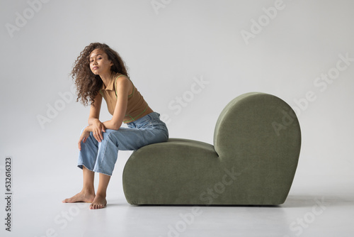 Beautiful young woman lying on a sofa photo