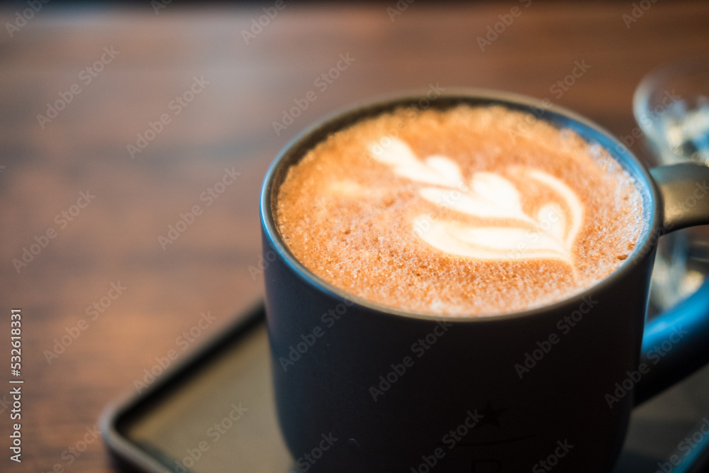 Hot mocha coffee. A cup of coffee with beautiful latte art. Close up Hot mocha coffee. A cup of coffee with beautiful latte art. Close up