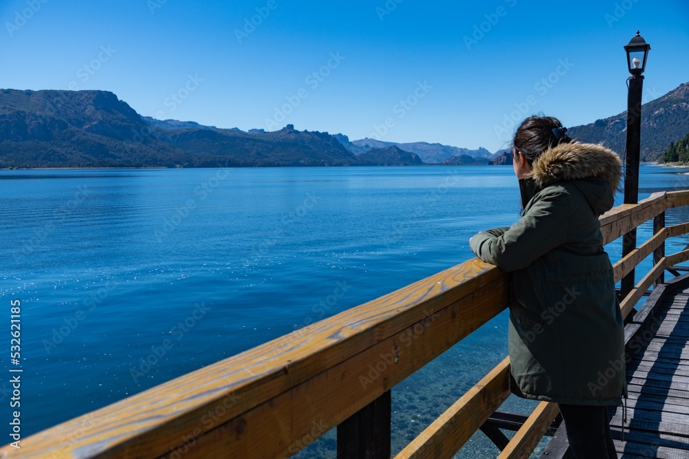couple sitting on a pier