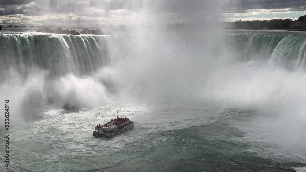 Niagara Falls, Canada, A boat with tourists is driving close to the famous Niagara Falls, Canada, A boat with tourists is driving close to the famous