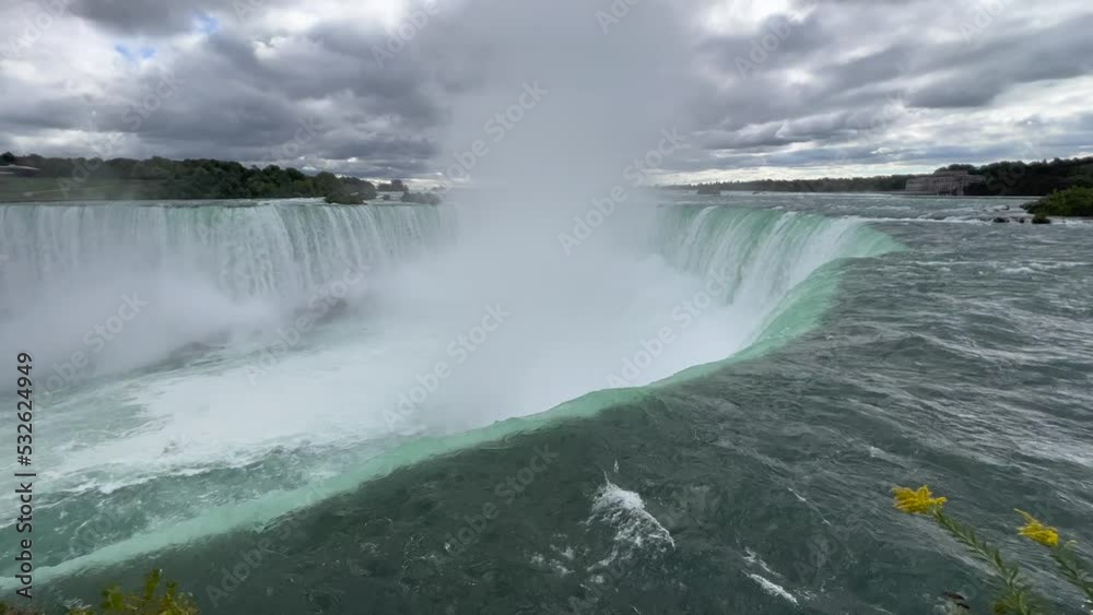 The horseshoe falls - part of Niagara Falls in Canada - close up of the upper edge, the falling water and the massive spume, produced by the fall The horseshoe falls - part of Niagara Falls in Canada - close up of the upper edge, the falling water and the massive spume, produced by the fall