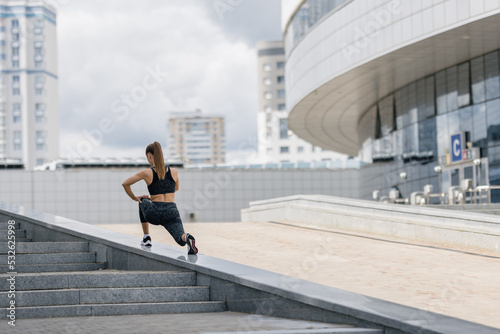 City workout, woman training in an urban setting 