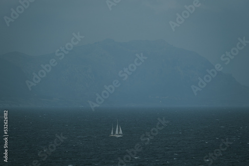 Sailboat in blue sea