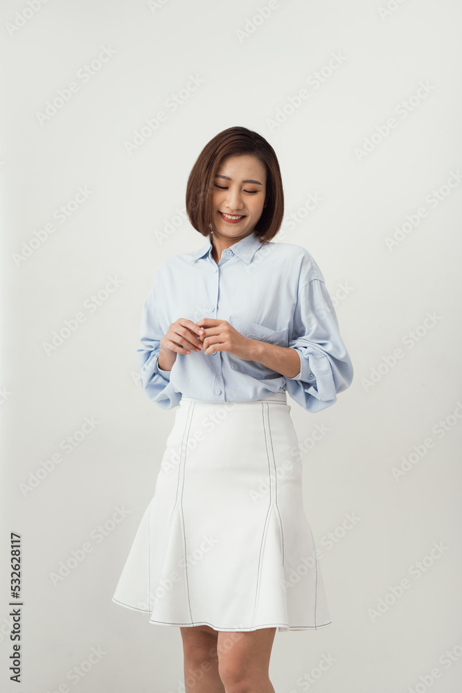 Young pretty asian woman laughs and closes eyes, feels relaxed a Young pretty asian woman laughs and closes eyes, feels relaxed a