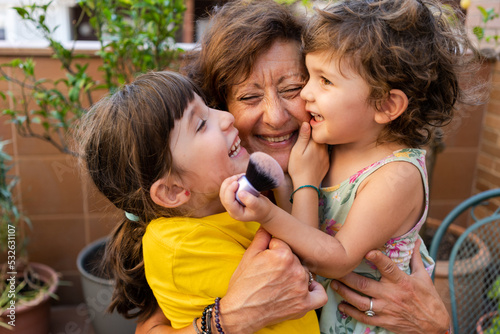 Playing with happy grandmother