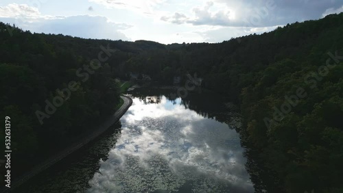 Beautifully clear Lake Harasov in the Kokorin valley, mirroring a sky full of clouds photo