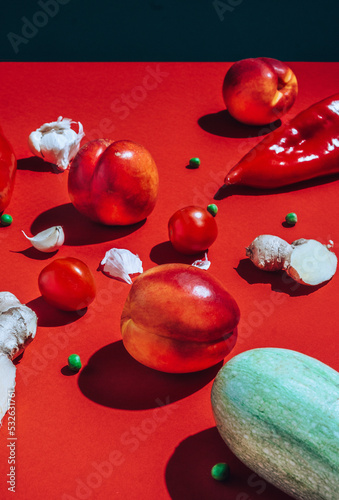 veggies and fruits on red  photo