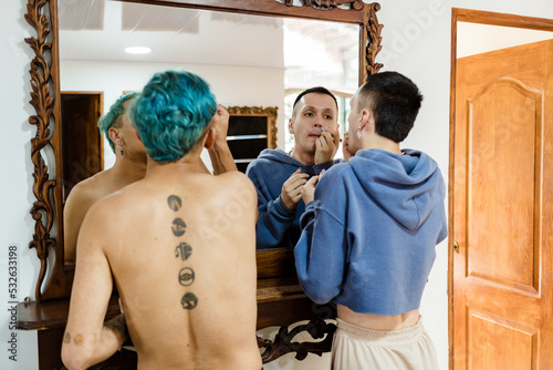 Couple of gay latino friends waxing photo