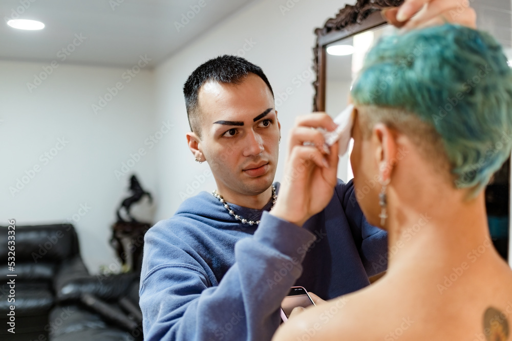 Man removing makeup from his friend's eyebrows Man removing makeup from his friend's eyebrows