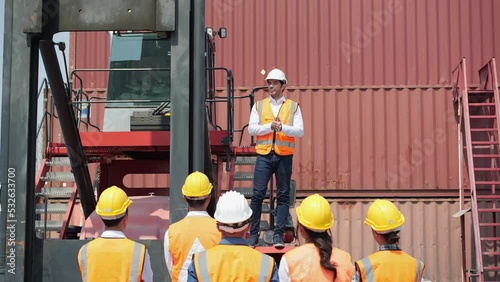 Workers gather to protest and expressed their displeasure at the cargo port with truck and container. Concept of movement, labor strike, work stoppage and revolution.