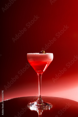 Cocktail drink on pink background photo