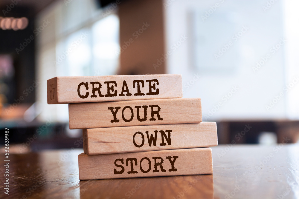 Wooden blocks with words 'Create Your Own Story'.