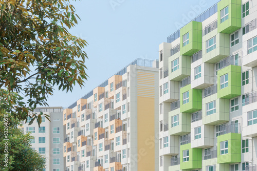 A green and orange building. photo