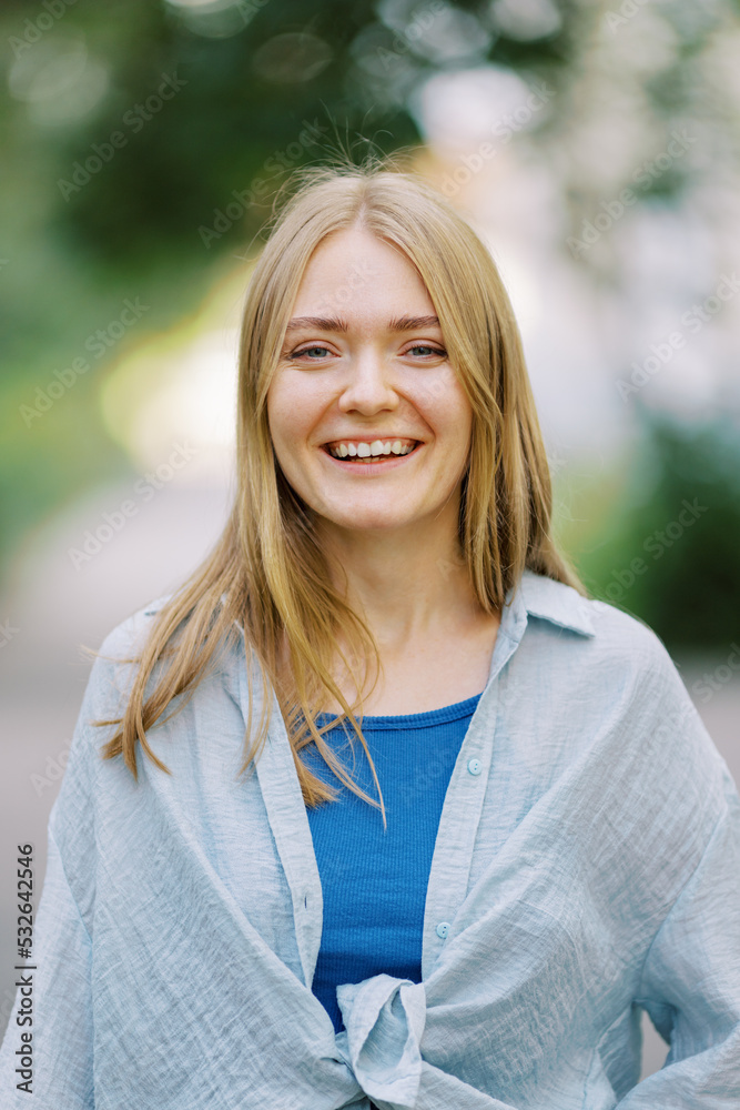 Happy young blond woman in closeup Happy young blond woman in closeup