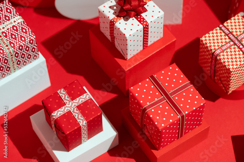 Christmas presents. Red and white themed gift holiday background. photo