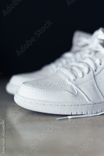 White Sneaker Basketball Shoes on Concrete