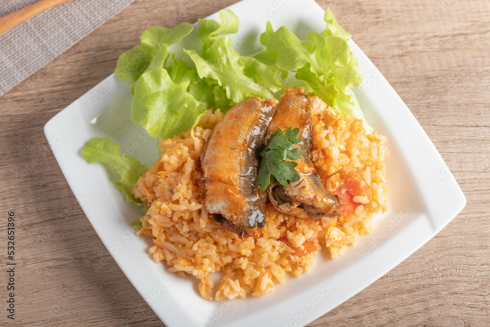 Fried rice with canned fish in a white plate.Thai food Fried rice with canned fish in a white plate.Thai food