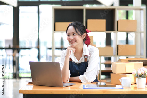 Business digital online SME small business a new startup in the present for an online shop. Happy Young Asian woman have a warehouse used to send a customer Entrepreneur owner SME or freelance concept