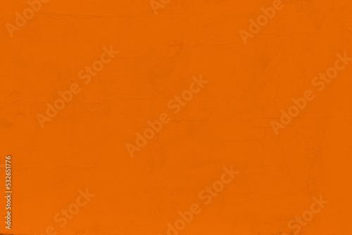 Saturated pastel orange colored low contrast Concrete textured background. Empty colourful wall texture with copy space for text overlay and mockups. 2023, 2024 color trend