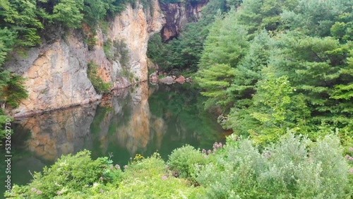 4K Drone Video of Beautiful Mountain Pond Surrounded by Trees at Emerald Village near Little Switzerland, NC on Summer Day