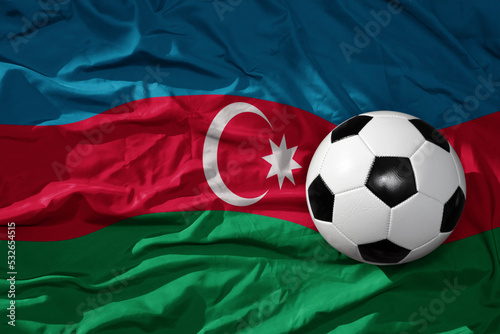 vintage football ball on the waveing national flag of azerbaijan background. 3D illustration